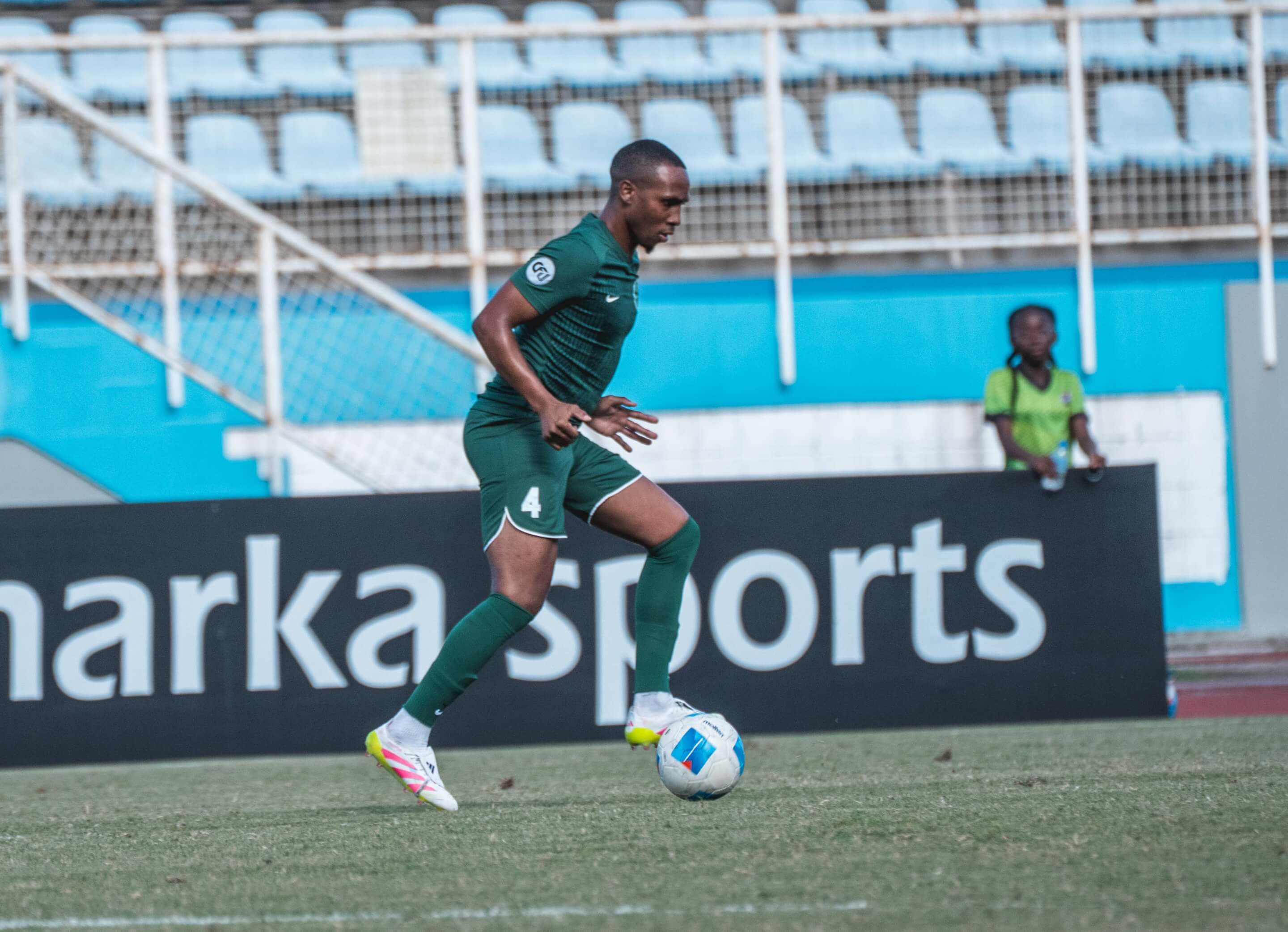 Player with reusable CFU Sleeve Badge on Football Jersey