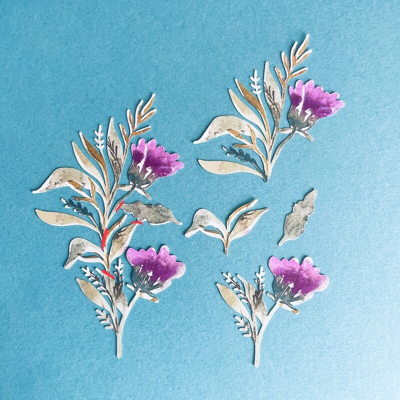 Farbige florale Stanzteile auf blauem Hintergrund, Stampin’ Up!