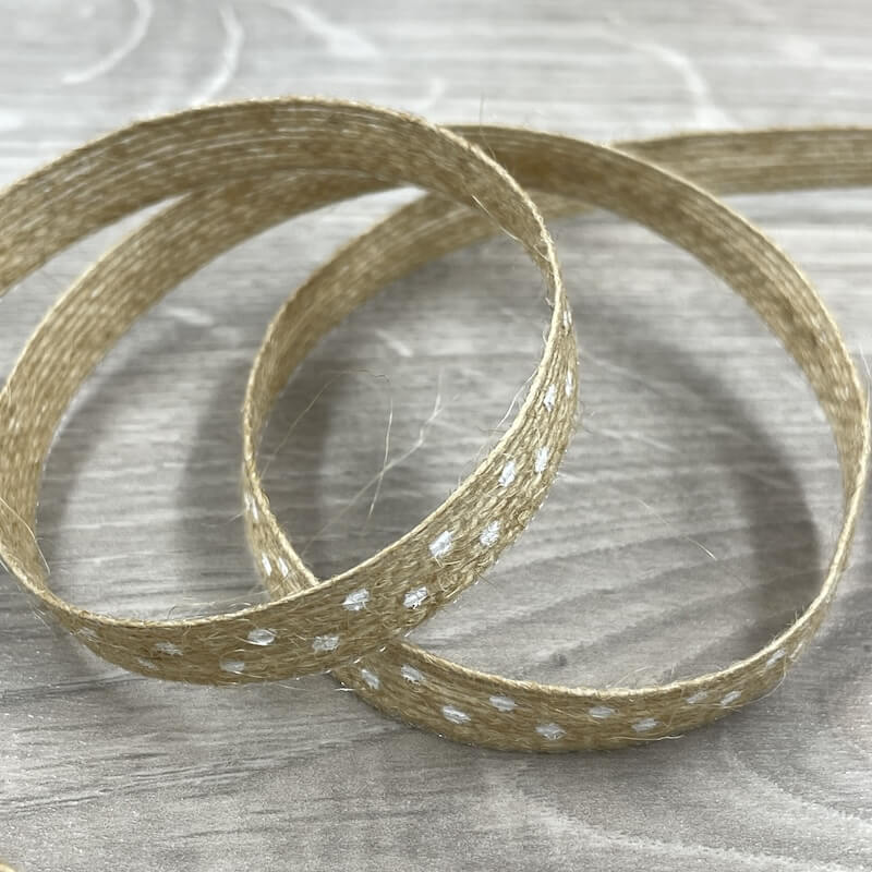 Naturband aus Jute mit weißen Punkten, locker aufgerollt