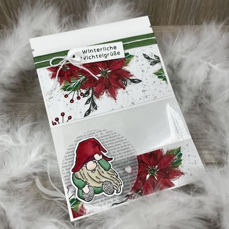 Verpackung mit Weihnachtsstern-Motiv, Winterliche Wichtelgrüße und Wichtel im Fenster